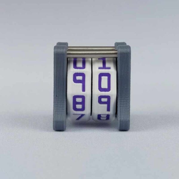 The NC-2 number counter viewed from the front. The version shown has a dark gray base and a pink heart in the middle on both sides 1 and 2.