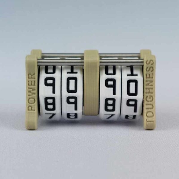 The CC-2x2 creature counter viewed from the front to clearly show the engraved words "power" and "toughness". This version shown is ivory white with great sword and sun shield.