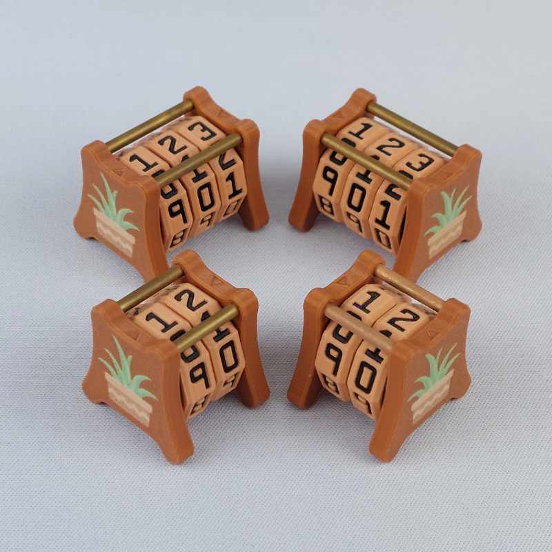 Two NC-2 and two NC-3 number counters grouped together to show the different size options and to show both side 1 and side 2 image designs in one photo. The version shown has a red-brown base with a image of an agave plant in a terracotta pot on both sides 1 and 2.