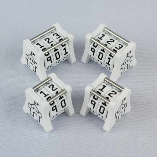 Two NC-2 and two NC-3 number counters grouped together to show the different size options and to show both side 1 and side 2 image designs in one photo. The version shown has a white base with a black castle outline in the middle on both sides 1 and 2. The small castle image is the Saint Onge Designs logo.